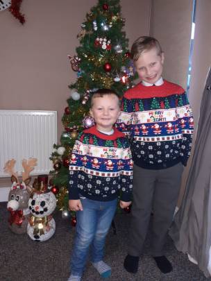 My boys wearing Xmas jumpers for last day of school & nursery